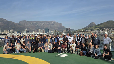 Seal Rabies discussion group photo on the Aghulas 2 with table mountain in the background