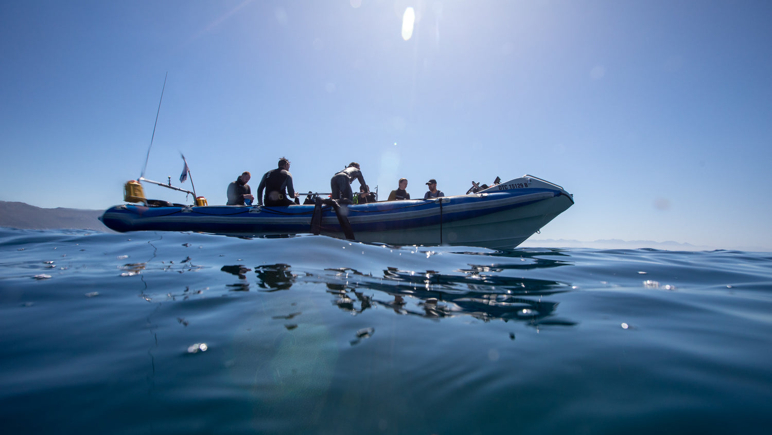 Scuba divers getting back on the boat
