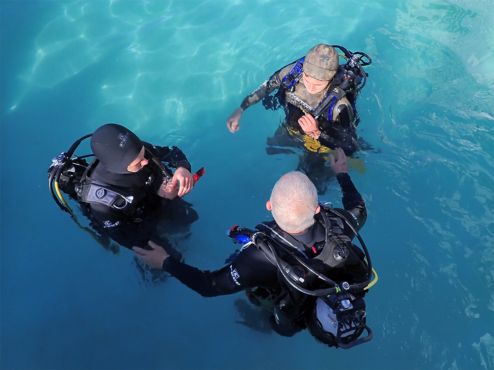 PADI instructor with two students doing the Open Water course