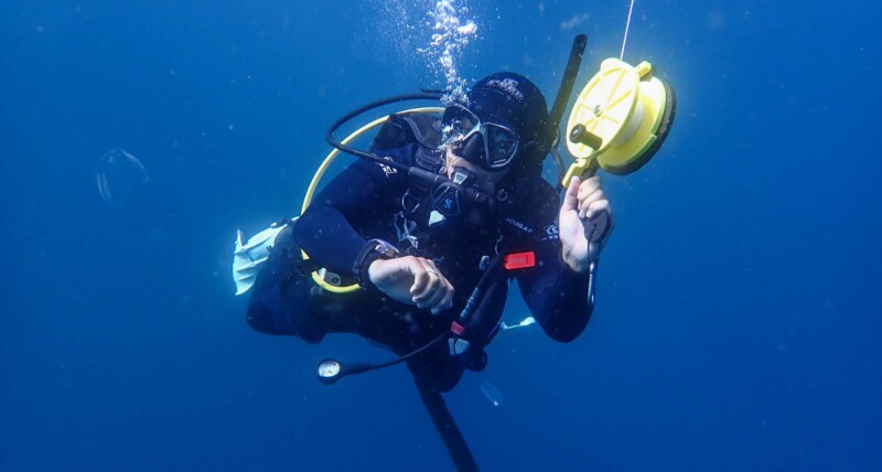 Scuba diver ascending from a deep dive in Cape Town
