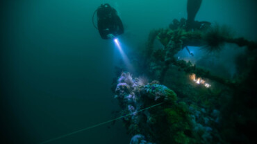 Scuba diver Exploring a dive site with limited visibility
